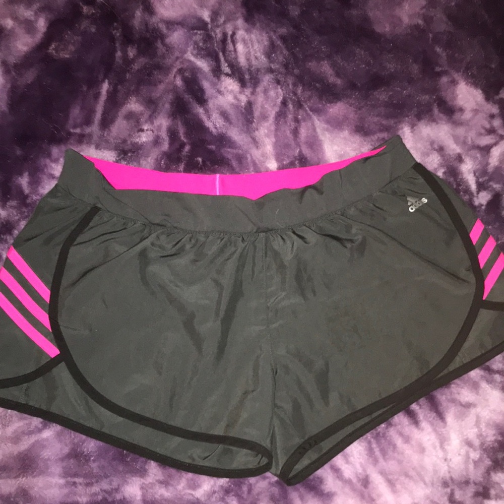 Adidas dark grey and pink athletic shorts.